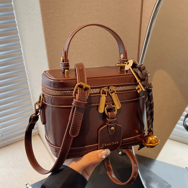 Elegant Vintage Women’s Crossbody Bag – Brown PU Leather Handbag with Bell Pendant, Adjustable Strap & Zipper Closure