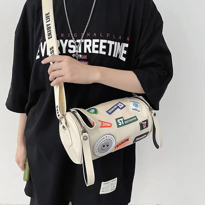 Unisex High-End Crossbody Bag – PU Cylinder Handbag with Brand Letter Badge, Buckle Closure & Golden Hardware