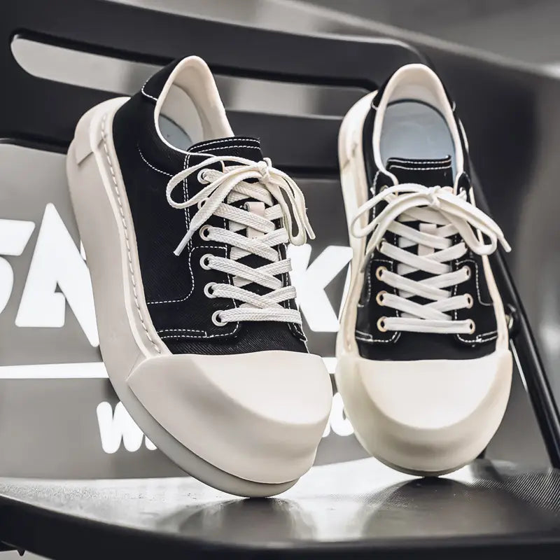Unisex Low-Top Canvas Sneakers with Lace-Up Closure Cushioned Rubber Sole Black White Minimalist Design