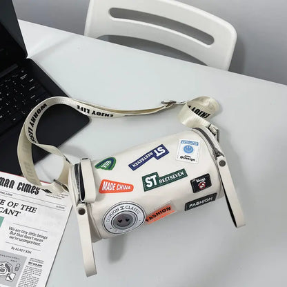 Unisex High-End Crossbody Bag – PU Cylinder Handbag with Brand Letter Badge, Buckle Closure & Golden Hardware