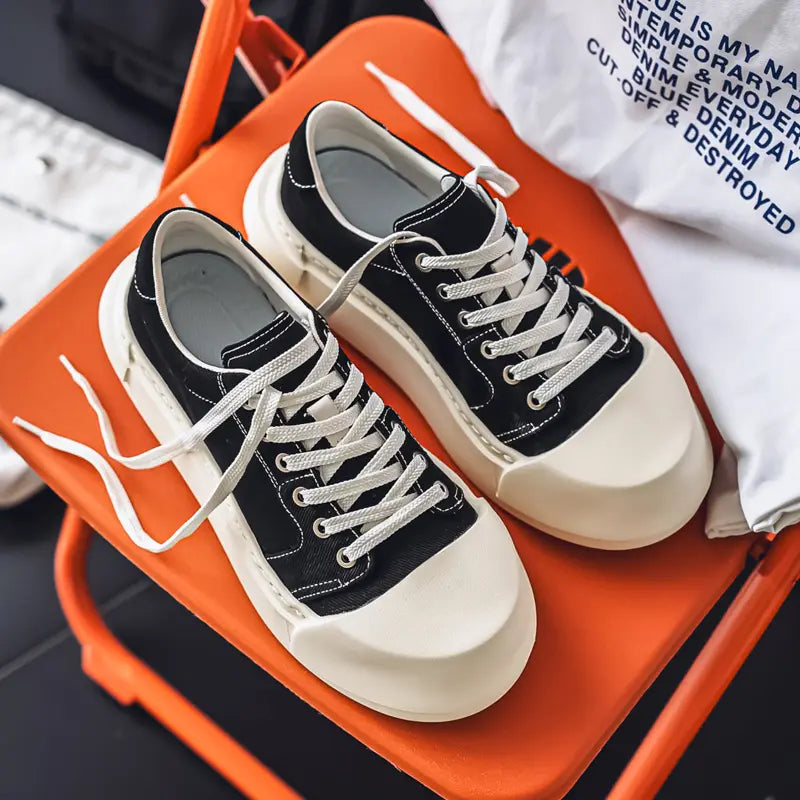Unisex Low-Top Canvas Sneakers with Lace-Up Closure Cushioned Rubber Sole Black White Minimalist Design